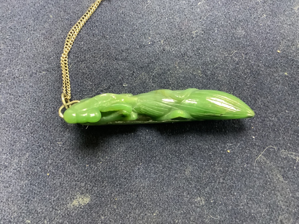 A Chinese jadeite pendant , a pair of bangles, earrings and a cricket pendant